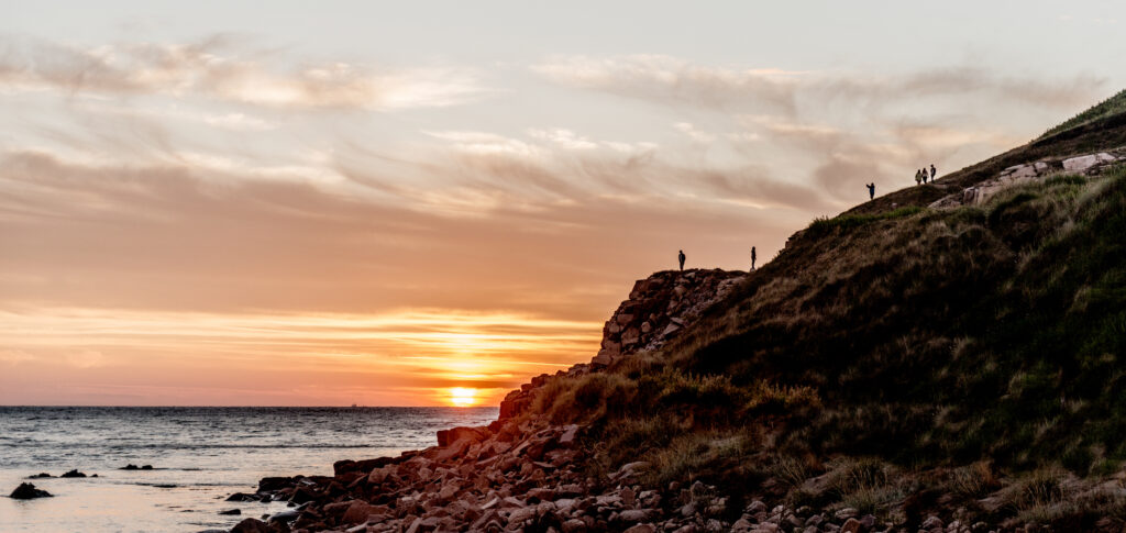 People walking on the cliff at Bornholm, Denmark
